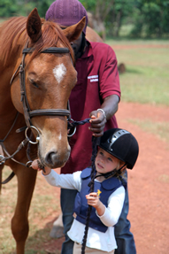 Child on pony ride horse